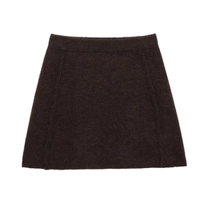 Detailed view of the dark brown A-line knit skirt with high waist and textured fabric