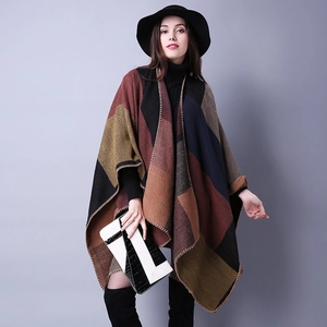 Detail of multi-color geometric knit shawl with color-block design and contrast stitching