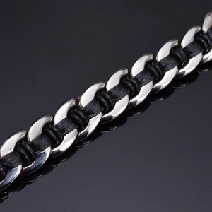 Macro shot of a 316L titanium steel double wolf head leather bracelet with metal weave