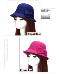 Detail of the oversized double bow decoration on felt cloche hats in blue and rose pink