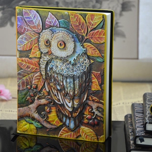 European vintage 3D embossed owl notebook with colorful leaf design on black background