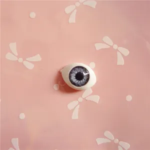 Detailed blue-grey realistic doll eyeball with fine iris texture and dark pupil