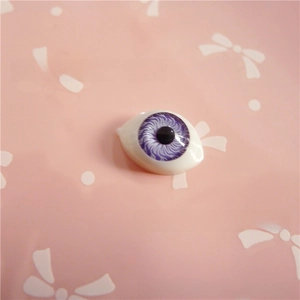Detailed macro view of a 12x16mm purple acrylic doll eye for DIY doll modification