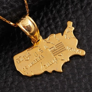 18K gold plated USA map pendant necklace with city engravings on black leather background