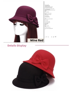 Detail of wool cloche hats with double bow decoration in burgundy, red, and black colors