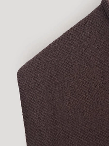 Detail of soft dark brown knit fabric with fine stitching and elastic texture