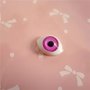 Detail of 12x16mm purple acrylic doll eye with deep iris for resin doll customization