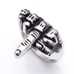 Macro shot of silver titanium steel ring featuring a creative vertical middle finger design
