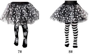 Detail view of girls' Halloween leggings featuring spider web and striped patterns