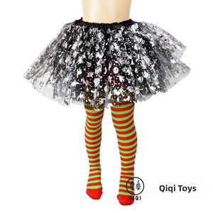 Close-up of kids Halloween tutu skirt with gold foil prints and red green striped tights