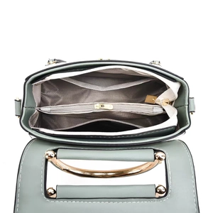 Top view of multi-compartment interior with wavy lining and gold hardware for crossbody bag