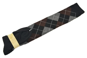 Detailed view of argyle patterned over-knee socks with yellow paper brand packaging