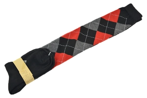 Detailed view of argyle patterned knit socks in classic red, black and grey tones