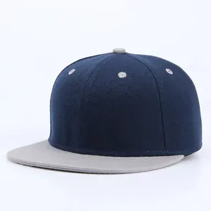 Contrast navy and grey snapback baseball cap in a minimalist hip-hop athletic style