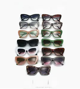 Collection of various cat-eye sunglasses and frames in diverse colors and textures