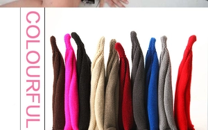 Close-up of vibrant multi-color knitted beanies showcasing varied fabric textures