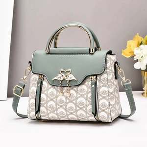 Chic Morandi green floral crossbody bag with gold handle and crystal swan emblem