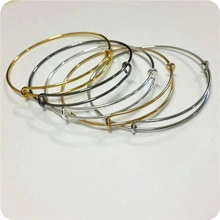 Set of six adjustable cutout round initial bracelets in gold, silver, and dark grey tones