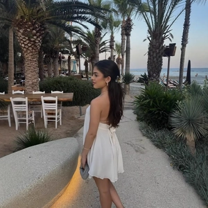 Elegant white halter backless mini dress in lightweight chiffon for summer beach vacation