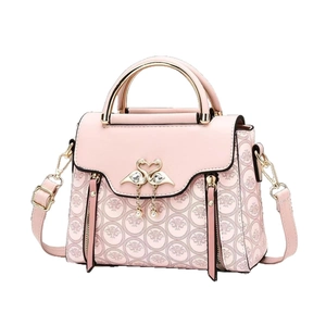 Pink crossbody bag with golden swan buckle and pearl tassels for women's fashion