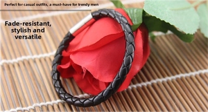 Close-up of black braided leather men's bracelet with silver tube magnetic clasp