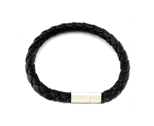 Macro detail of men's black braided PU leather bracelet featuring a silver magnetic clasp