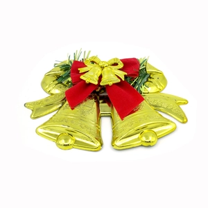Flat Christmas tree ornaments featuring golden bells with a red velvet bow and green pine leaves