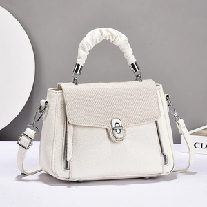 Elegant white crossbody bag with woven texture lid and decorative CD buckle detail
