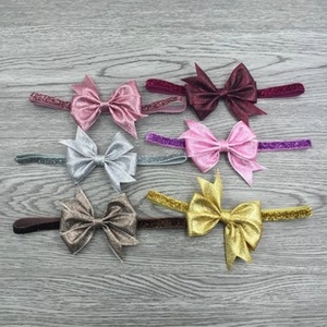 Detailed set of six sequin bow headbands in various colors for little girls