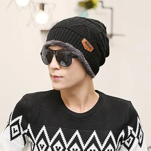 Men's winter knit beanie hat with thermal fleece lining in black shown on male model