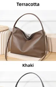 Detailed view of women's vintage hobo bag with thick lychee pattern leather and gold hardware