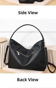 Detail view of the black lychee pattern leather bag with gold zippers and back pocket