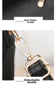 Detail of black lychee leather bag with gold metal buckle and rear zipper pocket