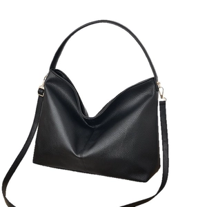Minimalist black lychee texture leather bucket bag with golden hardware for women