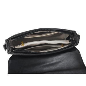 Detail view of the black crossbody bag's interior compartments and golden zipper hardware