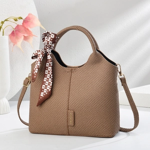 Elegant brown woven tote bag with silk scarf accent and versatile crossbody strap