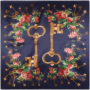 Detail of vintage navy silk scarf with golden keys and floral print patterns