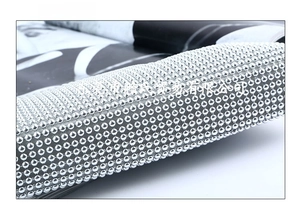 Detailed close-up showing the flexible silver beaded mesh bottom of the evening clutch bag