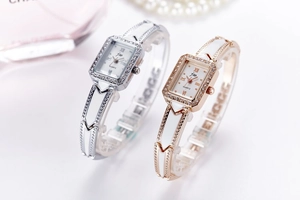 Detail of luxury women's rectangular quartz watches with rhinestones in silver and rose gold