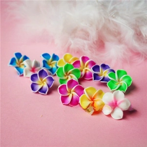Mix of colorful mini polymer clay plumeria flowers for DIY crafts and hair accessories