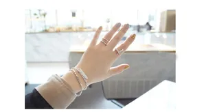 Close-up of S925 sterling silver double-layer lucky bracelet and geometric rings set