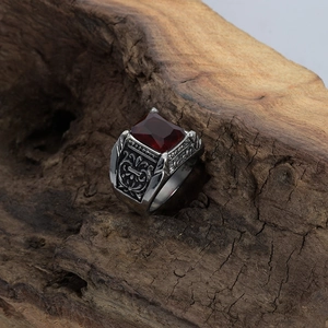 Vintage stainless steel ring for men featuring a square red ruby and ornate relief