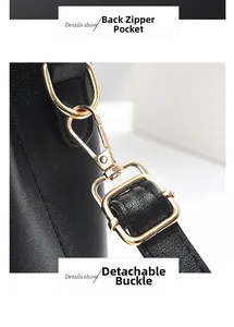 Détail d'un sac en cuir grainé avec crochet doré amovible et anneau métallique en D