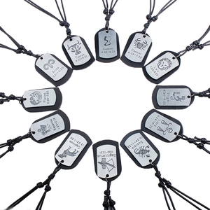 Set of 12 vintage zodiac pendants on black leather cords with engraved metal tags