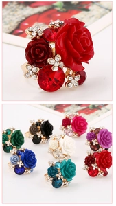 Close-up of resin rose ring with colorful gems and adjustable alloy band details