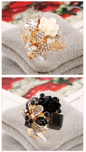 Detail of floral resin rings with colorful crystals and adjustable alloy band