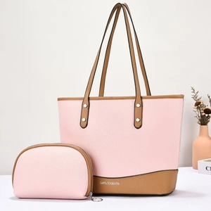 Close-up of pink and brown pebble leather tote bag with matching wristlet set