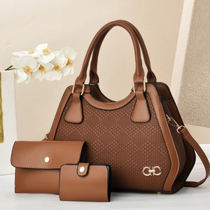 Detailed view of caramel brown three-piece handbag set with woven texture and gold hardware