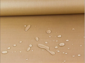 Close-up of waterproof non-stick baking cloth with water beads on fabric surface