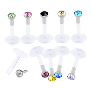 Macro detail of multi-colored crystal stud earrings with transparent bio-plastic stems